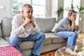 Senior caucasian couple in trouble sitting on the sofa at home Royalty Free Stock Photo