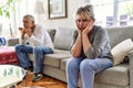 Senior caucasian couple in trouble sitting on the sofa at home Royalty Free Stock Photo