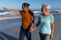 Senior Caucasian couple walking at the beach. Royalty Free Stock Photo