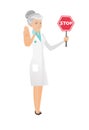 Senior caucasian doctor holding stop road sign.