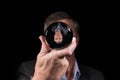 Senior businessman reflected upside down in a glass crystal ball to show world upside down Royalty Free Stock Photo