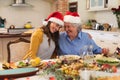 Senior caucasian woman and her adult daughter sitting at table for dinner together Royalty Free Stock Photo