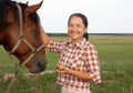 Senior caucasian woman with horse Royalty Free Stock Photo