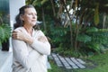 Senior caucasian woman standing with arms crossed in garden Royalty Free Stock Photo