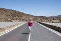 Senior Caucasian woman walking, posing and having fun on the road near Pico del Teide volcano, Tenerife, Spain Royalty Free Stock Photo