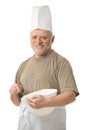 Senior chef whisking egg in kitchen Royalty Free Stock Photo