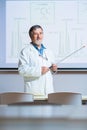 Senior chemistry professor giving a lecture in front of classroom Royalty Free Stock Photo