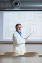 Senior chemistry professor giving a lecture in front of classroom Royalty Free Stock Photo