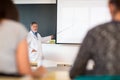 Senior chemistry professor giving a lecture Royalty Free Stock Photo