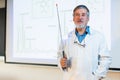 Senior chemistry professor giving a lecture Royalty Free Stock Photo