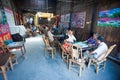 Senior chinese people playing mahjong in an ancient tearoom