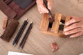 Senior Chinese seal carving artist at work Royalty Free Stock Photo