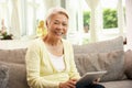 Senior Chinese Woman With Tablet Computer Royalty Free Stock Photo