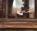 Senior citizen blur living room interior, wooden table in front Royalty Free Stock Photo