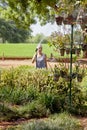 Senior citizen Caucasian Female watering trop