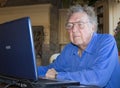 Senior citizen on computer