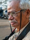 Senior citizen photographer waiting out side of mahakali cave mumbai