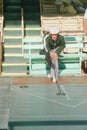 A senior citizen playing shuffleboard, Royalty Free Stock Photo