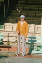 A senior citizen playing shuffleboard, Royalty Free Stock Photo