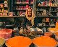 Senior citizen women running her shop