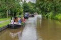 Senior citizens seen in a narrow boat on a boating trip.