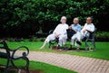 Senior Citizens sit in a garden