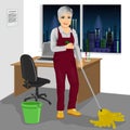 Senior cleaning woman mopping floor in office Royalty Free Stock Photo