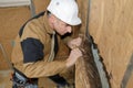 Senior contractor fitting wall insulation Royalty Free Stock Photo