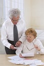 Senior couple with administratives papers Royalty Free Stock Photo