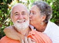 Senior Couple - Affectionate Kiss Royalty Free Stock Photo