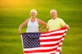 Senior couple with American flag. Royalty Free Stock Photo