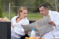 Senior couple in bathrobe standing on pontoon Royalty Free Stock Photo