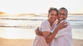 Senior couple, beach travel and hug by water of Dubai, happy on holiday for retirement and love by ocean. Portrait of Royalty Free Stock Photo