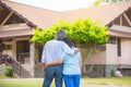 Senior couple from behind looking at front of house Royalty Free Stock Photo