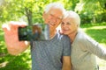 Senior couple taking selfie