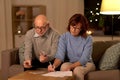 Senior couple with bills counting money at home Royalty Free Stock Photo