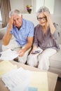 Senior couple with bills looking worried Royalty Free Stock Photo