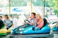 Senior couple in the bumper car at the fun fair Royalty Free Stock Photo