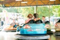 Senior couple in the bumper car at the fun fair Royalty Free Stock Photo