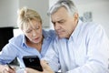 Senior couple calculating budget Royalty Free Stock Photo