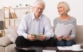 Senior couple calculating budget with papers and calculator Royalty Free Stock Photo