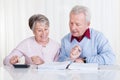 Senior couple calculating budget Royalty Free Stock Photo