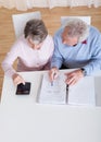 Senior couple calculating budget Royalty Free Stock Photo