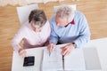 Senior couple calculating budget Royalty Free Stock Photo