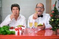 Senior couple celebrating new year eating grapes. Spanish new year tradition. Royalty Free Stock Photo