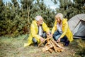 Senior couple cemping in the woods Royalty Free Stock Photo