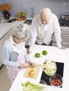 Senior couple chatting in kitchen Royalty Free Stock Photo