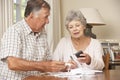 Senior Couple Checking Finances And Going Through Bills Together Royalty Free Stock Photo