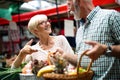 Senior family couple choosing bio food fruit and vegetable on the market during weekly shopping Royalty Free Stock Photo