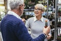 Senior couple are choosing potted plant at garden center Royalty Free Stock Photo